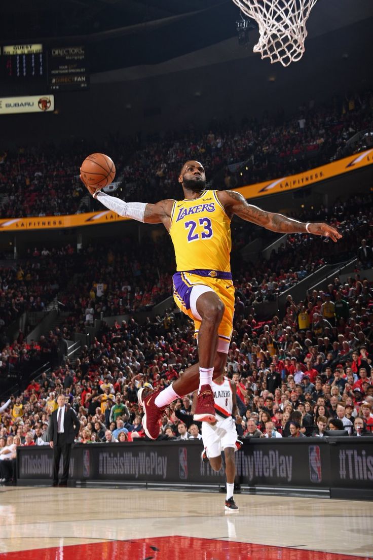 a basketball player jumping up into the air