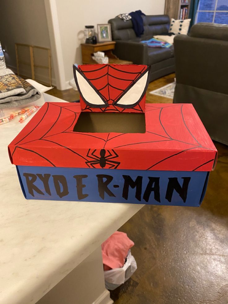 a cardboard box shaped like a spider man