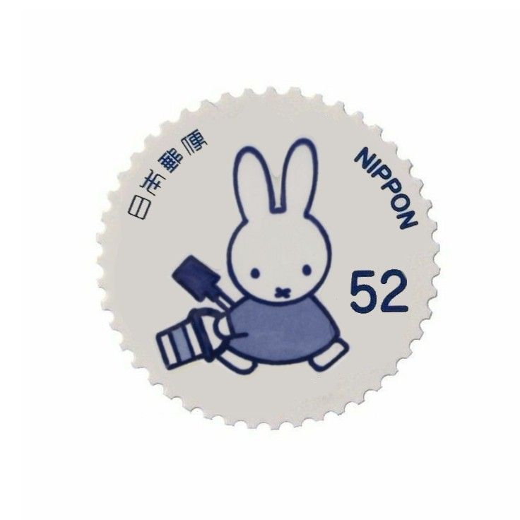 a white and blue sticker with an image of a rabbit holding a paintbrush