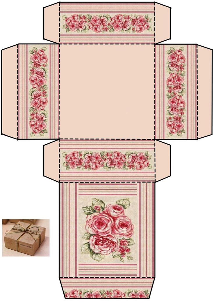 an open box with pink roses on it and the inside is cut out to look like a