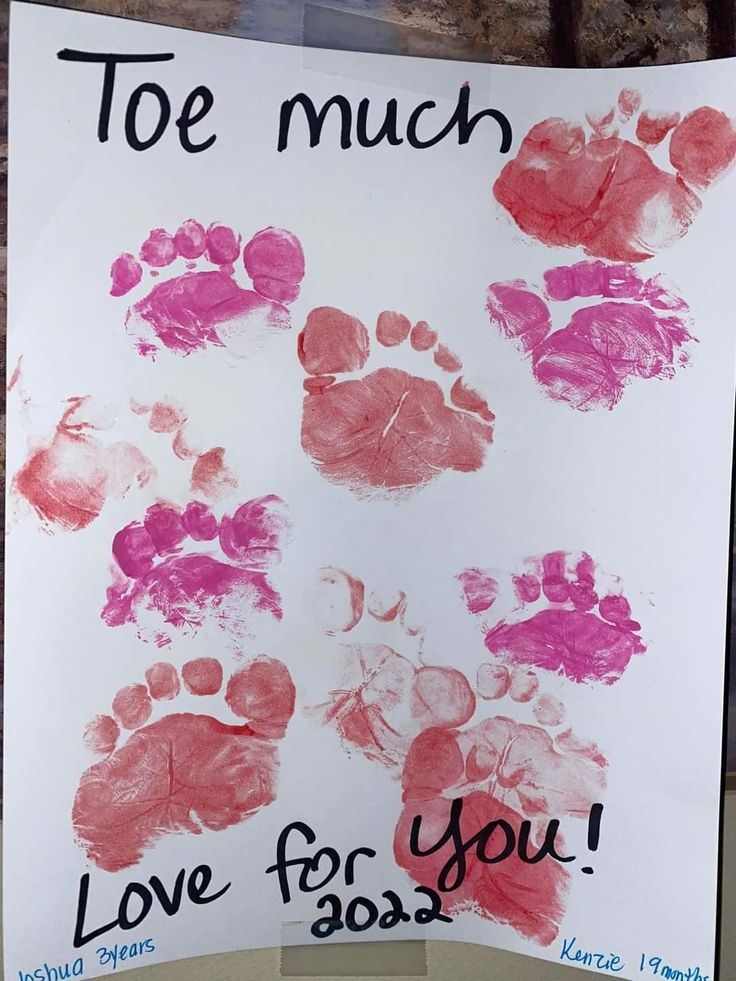 a handprinted sign that says too much love for you with pink and red prints