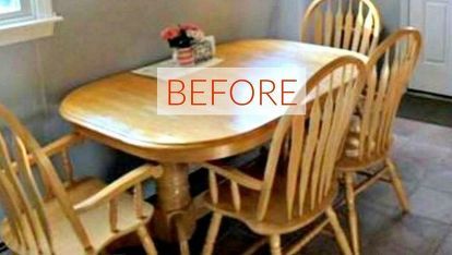 a dining room table and chairs in front of a window with flowers on the table