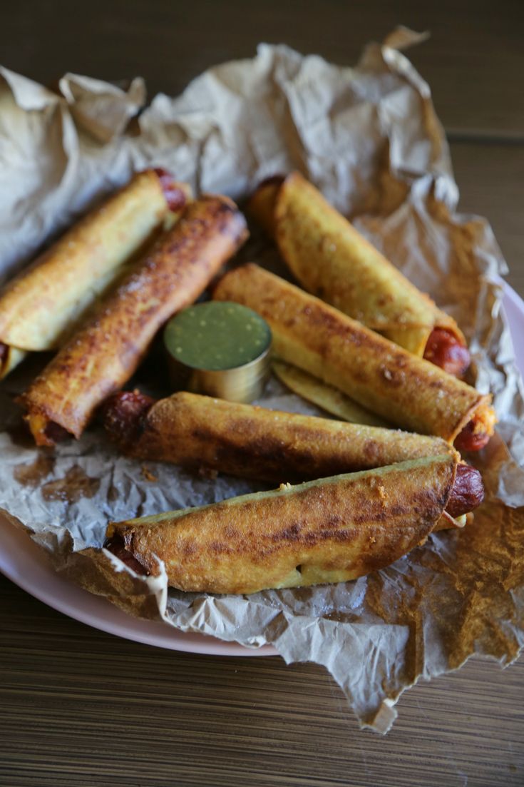 hot dogs and french fries are on a plate