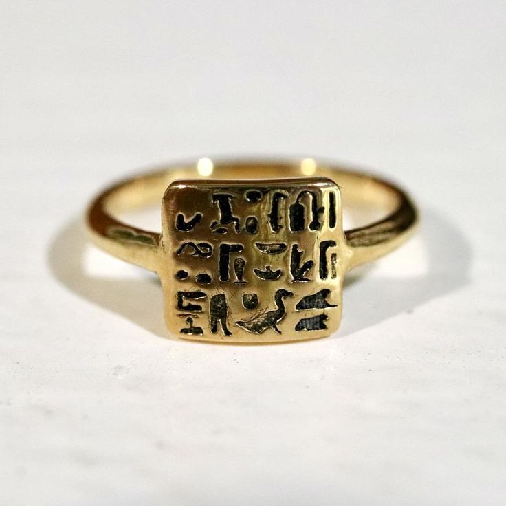 Lost wax cast reproduction of a late period signet ring Ancient Egyptian artifact created between 664–332 BC and housed at the Louvre. The ring describes the owner as Routy son of Imhotep, and his position as royal scribe (an esteemed job in ancient Egypt). Literally translated we get: "sS nsw xpr mDt nTr nb rwty sA imHtp" meaning "the royal scribe who was all god’s book, Routy son of Imhotep". This item is created by lost wax casting a 3d printed mold and is manufactured in the United States. T Ancient Egyptian Artifacts, Late Period, Ancient Egyptian Jewelry, Egyptian Artifacts, Egyptian Jewelry, The Louvre, Wax Casting, Lost Wax Casting, Lost Wax