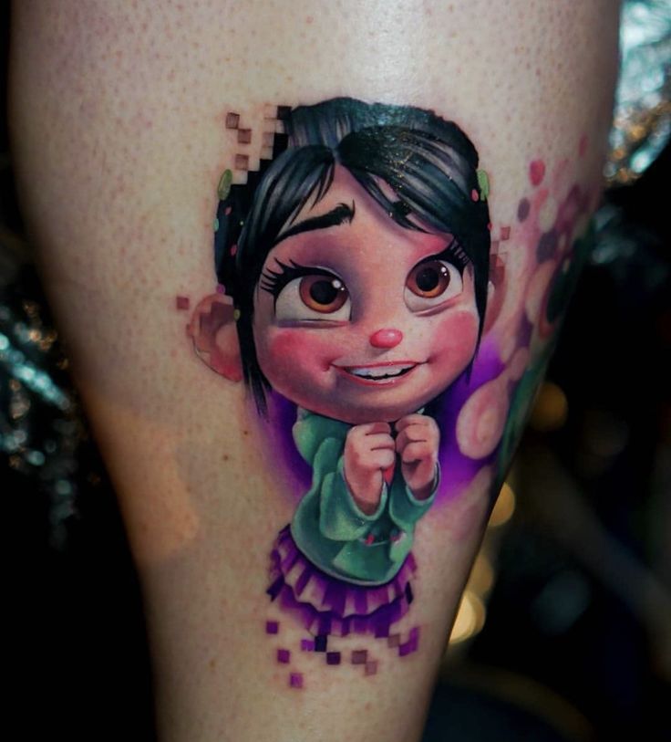 a close up of a person's leg with a cartoon character tattoo on it