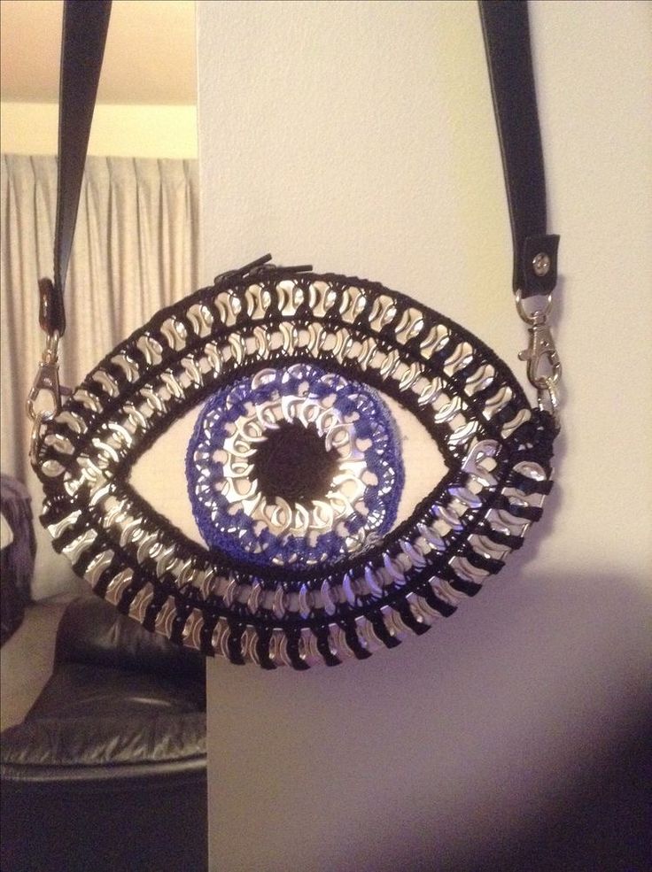 an evil eye purse hanging on the wall