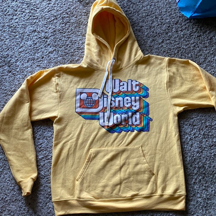 Yellow Walt Disney World Hoodie Great Condition Besides The Few Markings Never Used Nwot If D1 Disney Letter Print Sweatshirt For Winter, Disney Letter Print Sweatshirt For Streetwear, Disney Style Cotton Sweatshirt With Letter Print, Disney Cartoon Print Sweatshirt For Fan Events, Casual Sweatshirt With Character Print For Disney Fan Events, Casual Sweatshirt With Character Print For Disney Events, Disney Cartoon Print Hooded Sweatshirt, Disney Hooded Sweatshirt With Cartoon Print, Disney Letter Print Sweatshirt For Fan Events