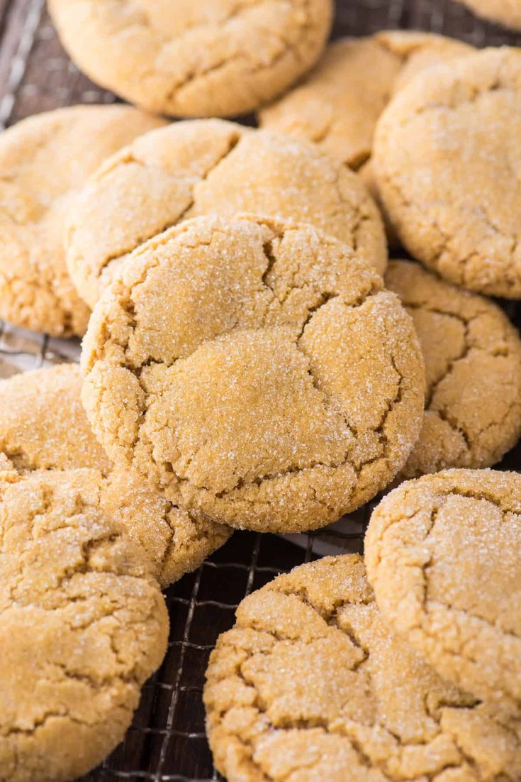 a bunch of cookies that are on a cooling rack