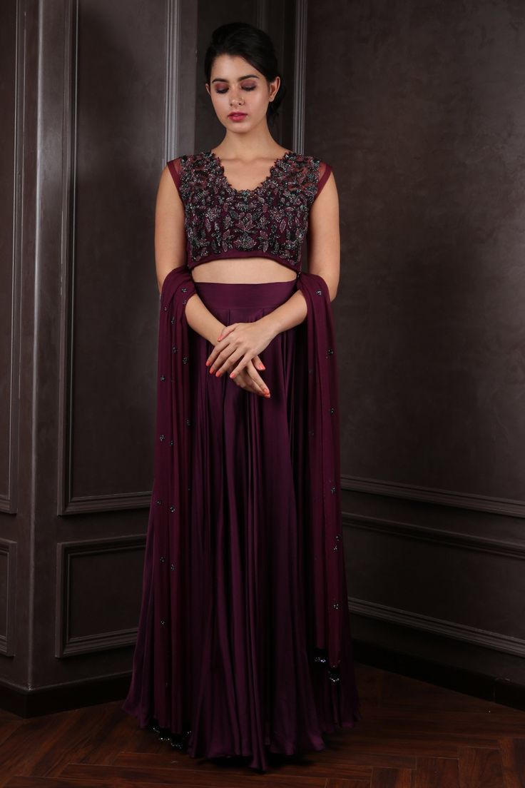 Wine lehenga in satin silk base. Comes with cutdana floral embroidered blouse and dupatta.
Component: 3
Pattern: Embroidered
Type Of Work: Cutdana
Neckline: V-Neck
Sleeve Type: Cap
Fabric: Satin Silk, Net
Color: Wine
Other Details: 
Tassel hem dupatta
Cutwork neckline
Occasion: Destination Wedding - Aza Fashions Art Silk Party Sets With Traditional Drape, Silk Choli For Formal Eid Occasion, Anarkali Style Chinon Sets For Reception, Anarkali Chinon Sets For Reception, Art Silk Sets With Traditional Drape For Party, Formal Georgette Choli With Traditional Drape, Unstitched Art Silk Sets For Reception, Formal Georgette Lehenga With Dupatta, Purple Semi-stitched Formal Set