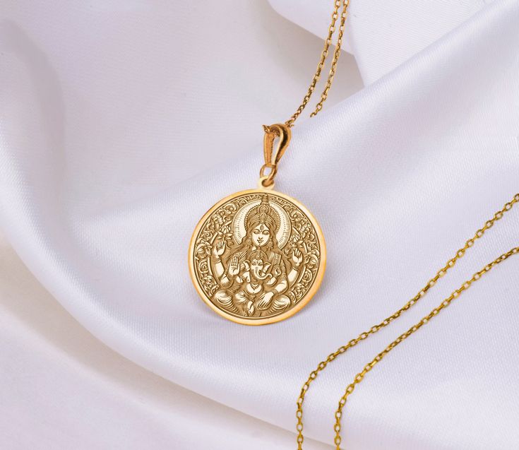 The serene image of Buddha in meditation atop a delicate lotus flower symbolizes enlightenment and growth. Elevate your spiritual journey and adorn yourself with this meaningful accessory.I hope it brings peace and health to you and your life. * Gender : Male / Female * Material Options  : 14K Solid Gold , Sterling Silver , 14K Gold Plated, Rose Gold Plated * Rose plated and gold plated pendants  are madeon 925 sterling silver. * Material : 14K Solid Gold thickness 0.8 * Material : 925 Sterling Round Temple Necklace For Navratri Gift, Navratri Gift Temple Necklace, Round Spiritual Temple Necklace As Gift, Spiritual Round Temple Necklace As Gift, Round Hallmarked Temple Necklace For Gifting, Round Hallmarked Temple Necklace As Gift, Hallmarked Round Temple Necklace As Gift, Yellow Gold Round Pendant Temple Necklace As Gift, Yellow Gold Temple Necklace With Round Pendant