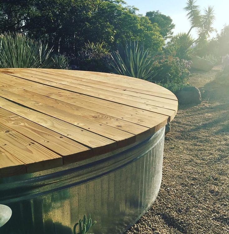 a hot tub sitting on top of a wooden deck