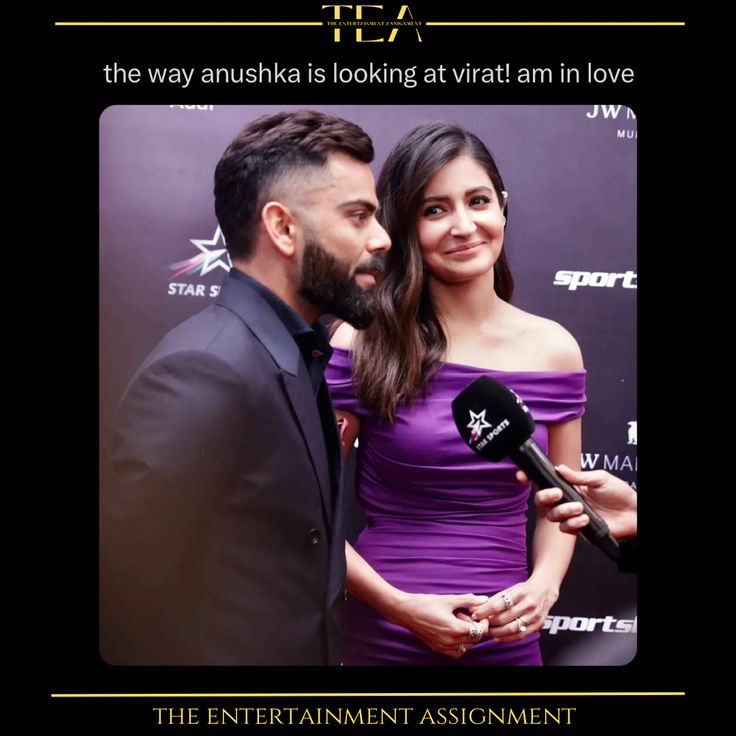 a man and woman standing next to each other on a red carpet with microphones