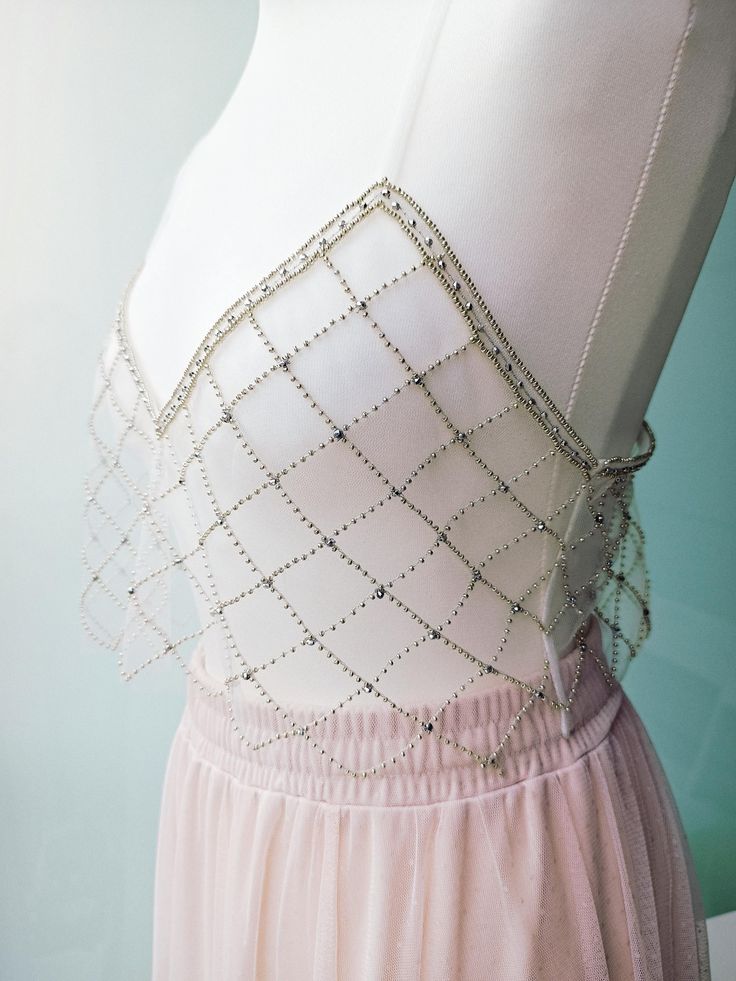 Incredibly delicate top made of tulle and decorated with hand couture embroidery - a geometric pattern of silver beads.  Such a thing looks like a real gem and is always in fashion. The width of the top 44 cm ( 17.32") Strap length 41 cm (16.14") Fits S and M size. Elegant Sheer Evening Crop Top, Elegant Fitted Sheer Crop Top, Elegant Sheer Crop Top For Evening, Embellished Evening Crop Top For Summer, Elegant Sheer Crop Top For Summer, Embellished Crop Top For Summer Evenings, Silver Fitted Crop Top With Rhinestones, Elegant Embellished Wedding Crop Top, Silver Rhinestone Fitted Crop Top