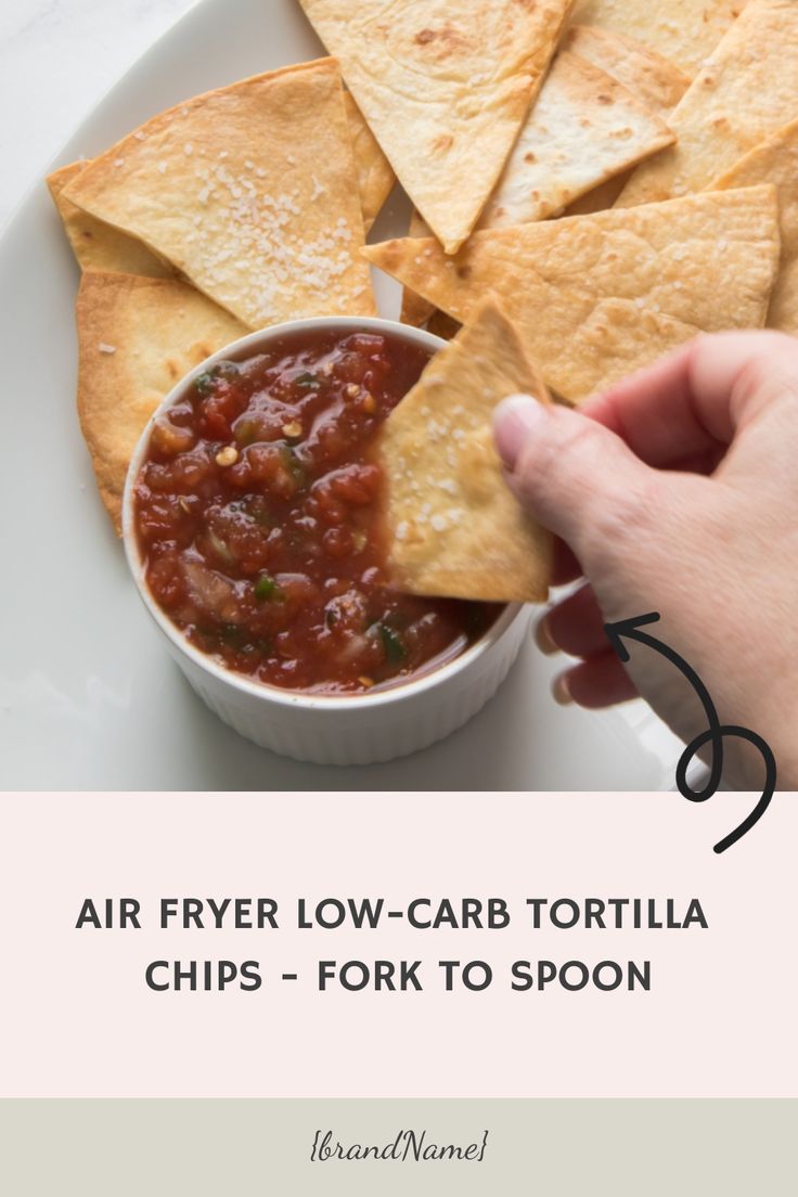 a person dipping tortilla chips into a bowl with salsa in it and text overlay reading air fryer low - carb tortilla chips - fork to spoon