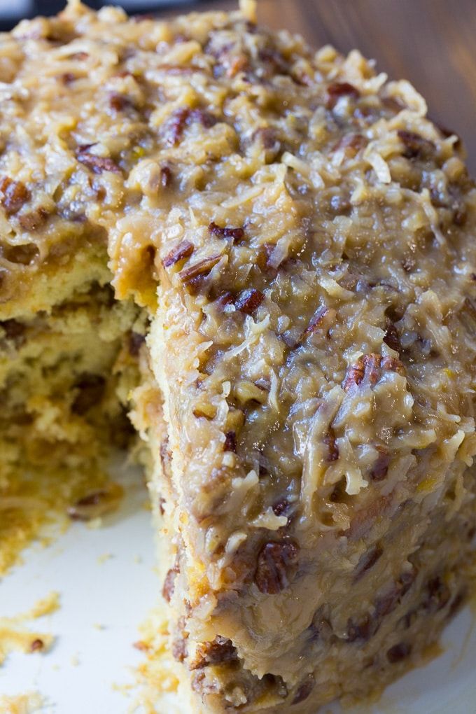 a close up of a cake on a plate with one slice missing from the cake