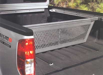 the back end of a silver truck with a metal basket in it's bed