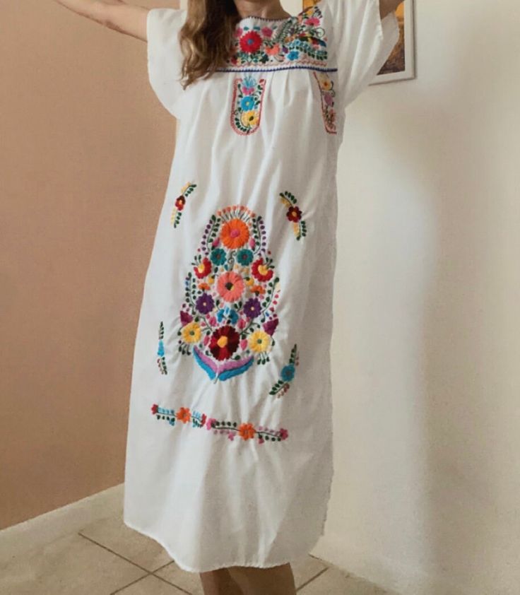 "Ideal for sunny afternoons in the park with friends or rocking it poolside on vacay! This beautiful hand embroidered number was discovered in the Catskills.  Shoulder: 17\" Bust: 34\" Waist: Free Size, Fits up to 38\" Length: 42\" Fabric: 💯 cotton" Casual Embroidered Dresses For Beach Season, Long Sleeve Embroidered Summer Beach Dress, Casual Embroidered Dress For Beach, Embroidered Long Sleeve Dress For Summer Beach, Folk Style Long Sleeve Embroidered Dress For Summer, Long Sleeve Folk Embroidered Dress For Summer, Folk Style Long Sleeve Embroidered Summer Dress, Casual Embroidered Cotton Dress For Vacation, Casual Cotton Embroidered Dress For Vacation