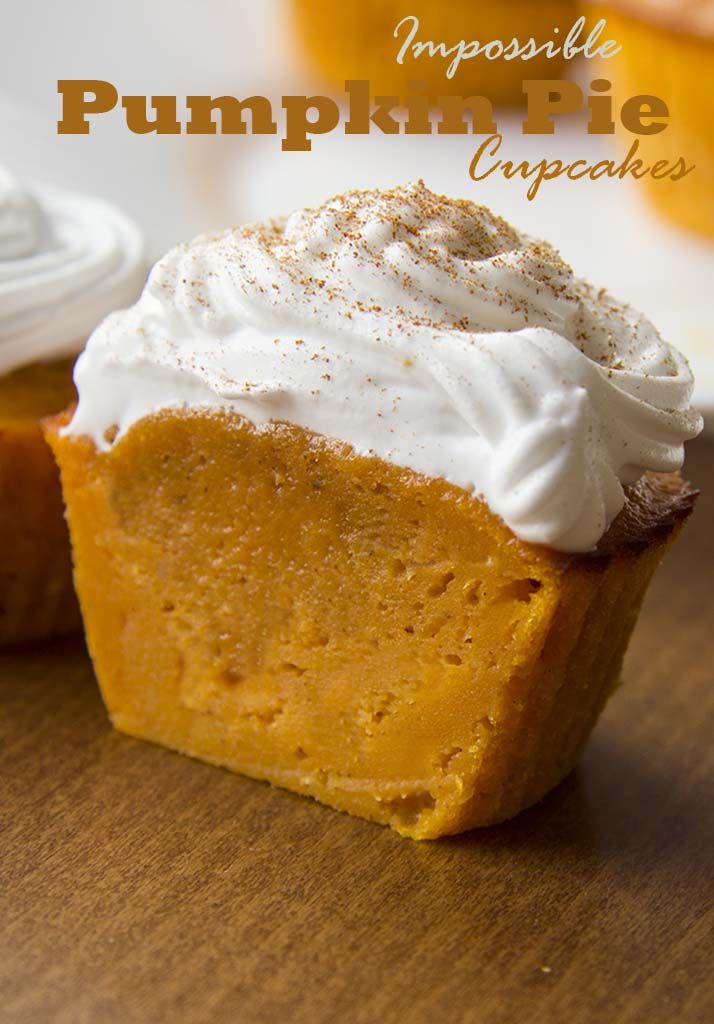 pumpkin pie cupcakes with whipped cream on top