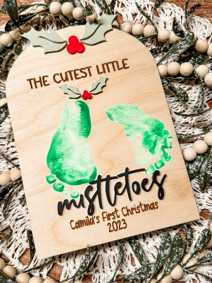 a wooden ornament that says the cute little mistetos