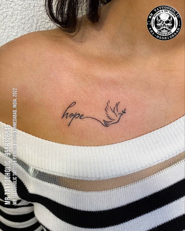 a woman's chest with the word hope written in cursive writing on it