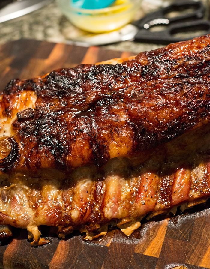 a piece of meat sitting on top of a wooden cutting board