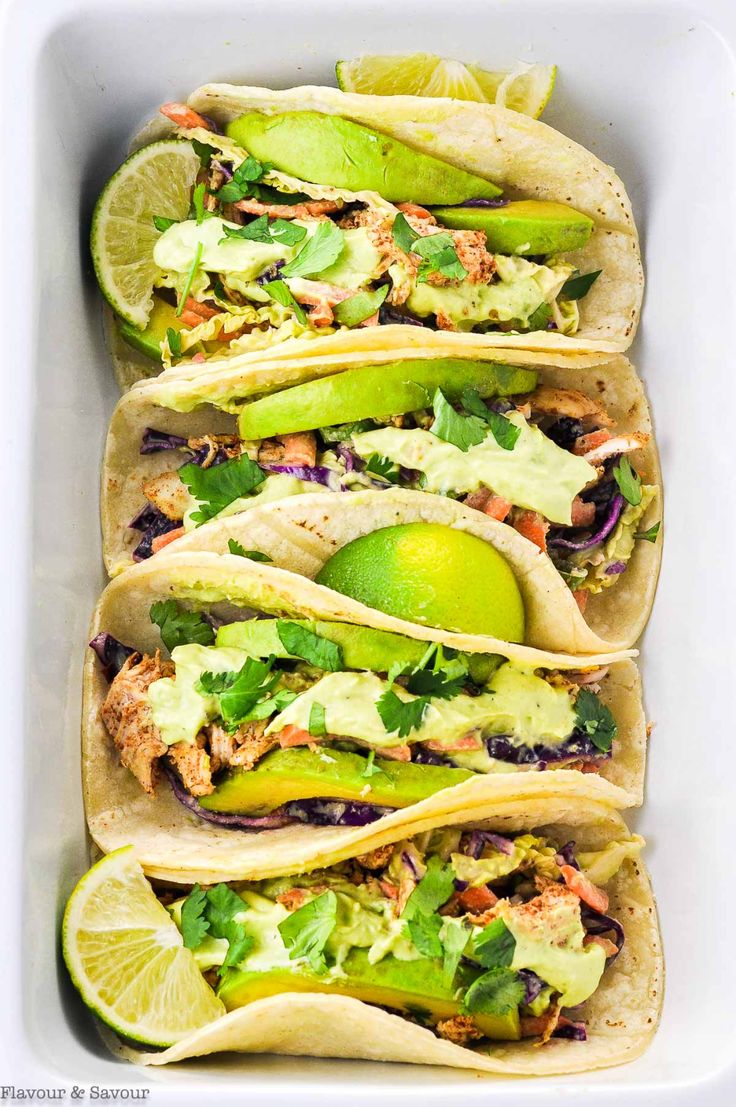 shredded chicken tacos with cilantro lime slaw are ready to be eaten