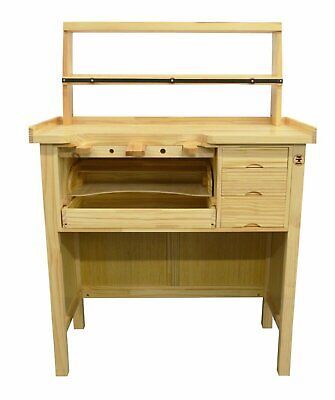 a wooden desk with drawers and shelves on the bottom shelf, in front of a white background