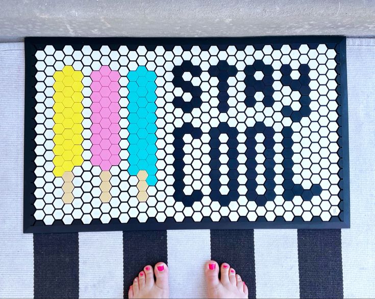 a person standing in front of a board game that says start with letters on it