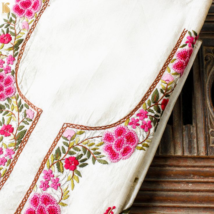 White Handcrafted Parsi Gara Dupion Silk Kurta Fabric - Khinkhwab Tussar Silk Kurta With Embroidered Border For Eid, Eid Tussar Silk Kurta With Embroidered Border, Semi-stitched Tissue Silk Kurta With Embroidered Border, Bollywood Style Tissue Silk Kurta With Embroidered Border, Raw Silk Kurta With Floral Embroidery In Traditional Drape, Festive Tussar Silk Kurta With Embroidered Border, Festive Tussar Silk Kurta With Floral Embroidery, Tussar Silk Kurta With Resham Embroidery For Festivals, Wedding Kurta With Embroidered Border In Tissue Silk