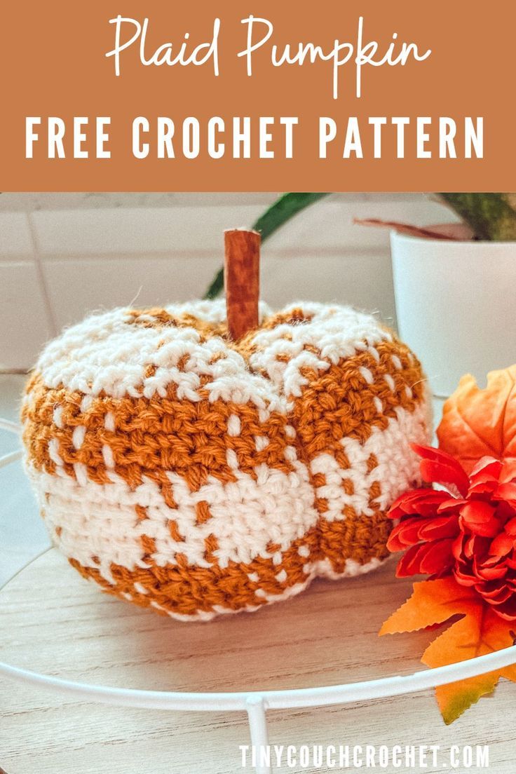 two crocheted pumpkins sitting on top of a table