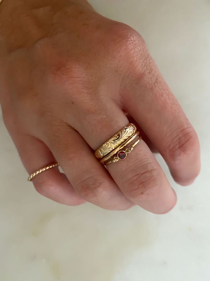 The floral ring set is one of our most-loved sets that features our floral band and simple gold band, that together make a gorgeous pair. Available in Gold Filled or Sterling Silver *Made to order (Processing time of 7-10 business days) This set fits true to size Floral band width: 4 mm Simple gold band width: 1.6 mm Simple Gold Band, Birthstone Rings, Hammered Band, Floral Ring, Dope Jewelry, Nail Jewelry, Classy Jewelry, Stacked Jewelry, Funky Jewelry