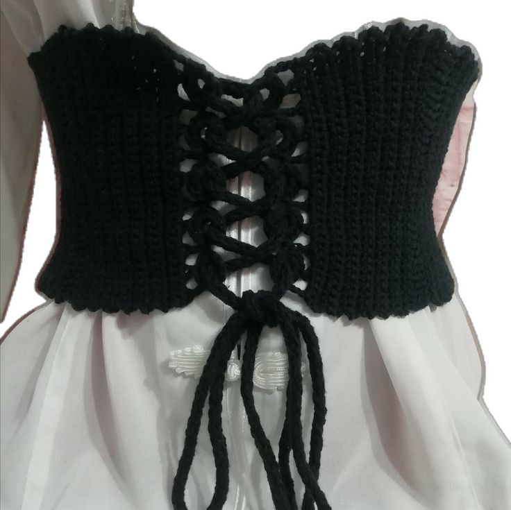 black crochet corset on white dress