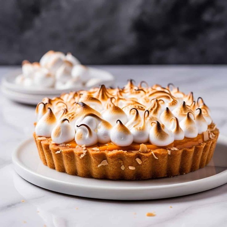 a dessert with whipped cream on top is sitting on a plate