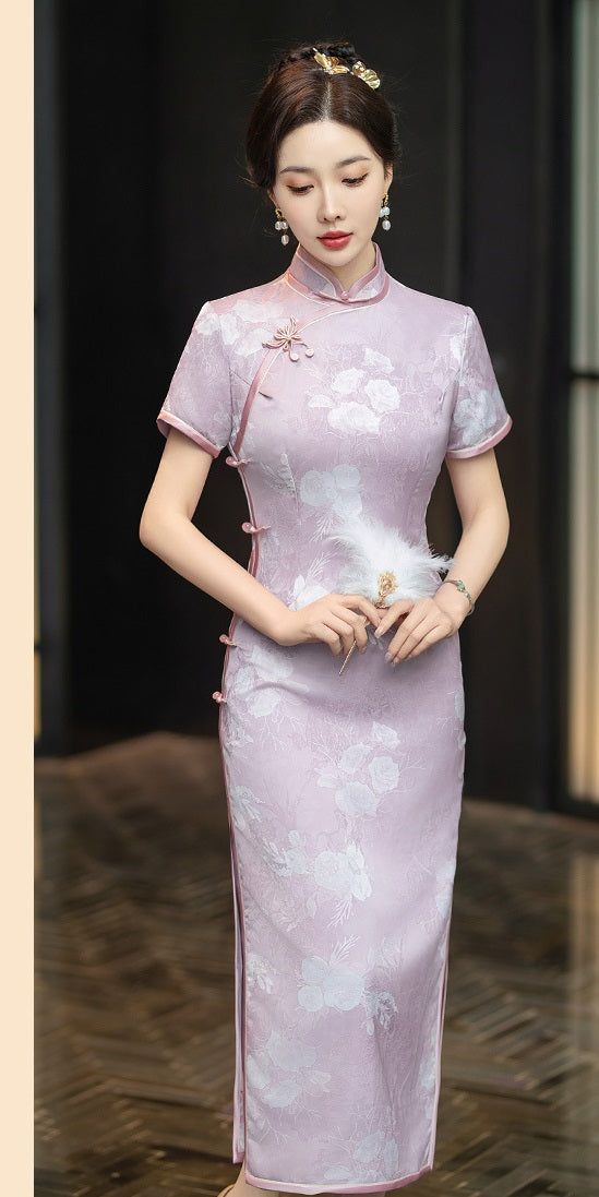 Indulge in the exquisite elegance of this purple Cheongsam dress. Featuring a delicate floral design and a traditional mandarin collar, this ankle-length dress is adorned with two subtle side slits, creating a timeless and sophisticated silhouette, perfect for any special occasion. Size Guide: Please refer to the size guide picture before placing the order. Please leave your Height, Weight, Bust, Waist and Hip measurements in the Personalisation box so we could double check the size for you. Purple Cheongsam, Purple Qipao, Chinese Formal Dress, Chinese Dress Modern, Traditional Qipao, Chinese Qipao, Qipao Cheongsam, Traditional Chinese Dress, Qipao Dress