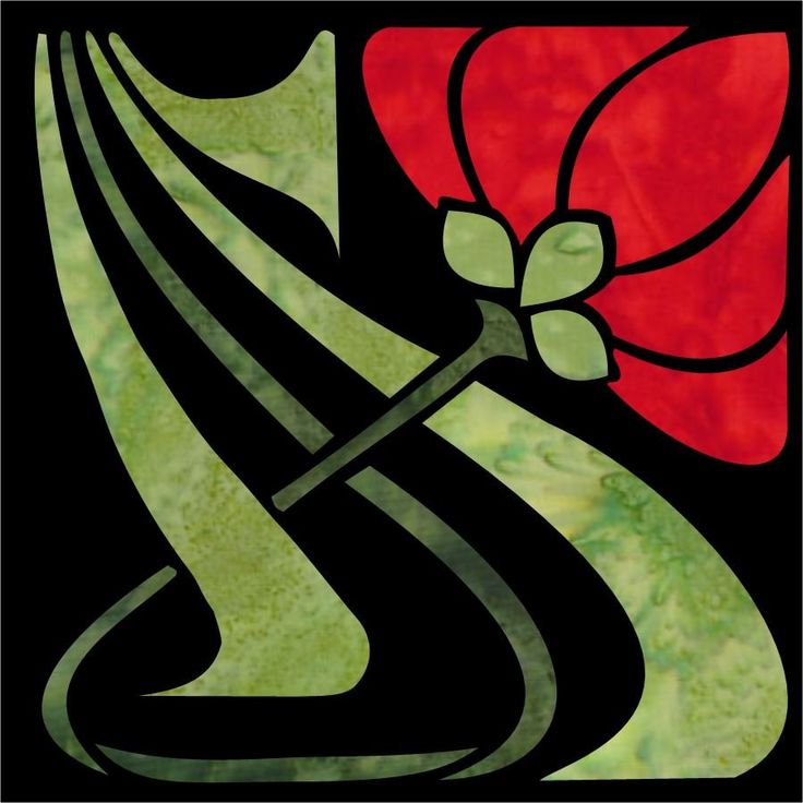 a stained glass window with a red flower on it