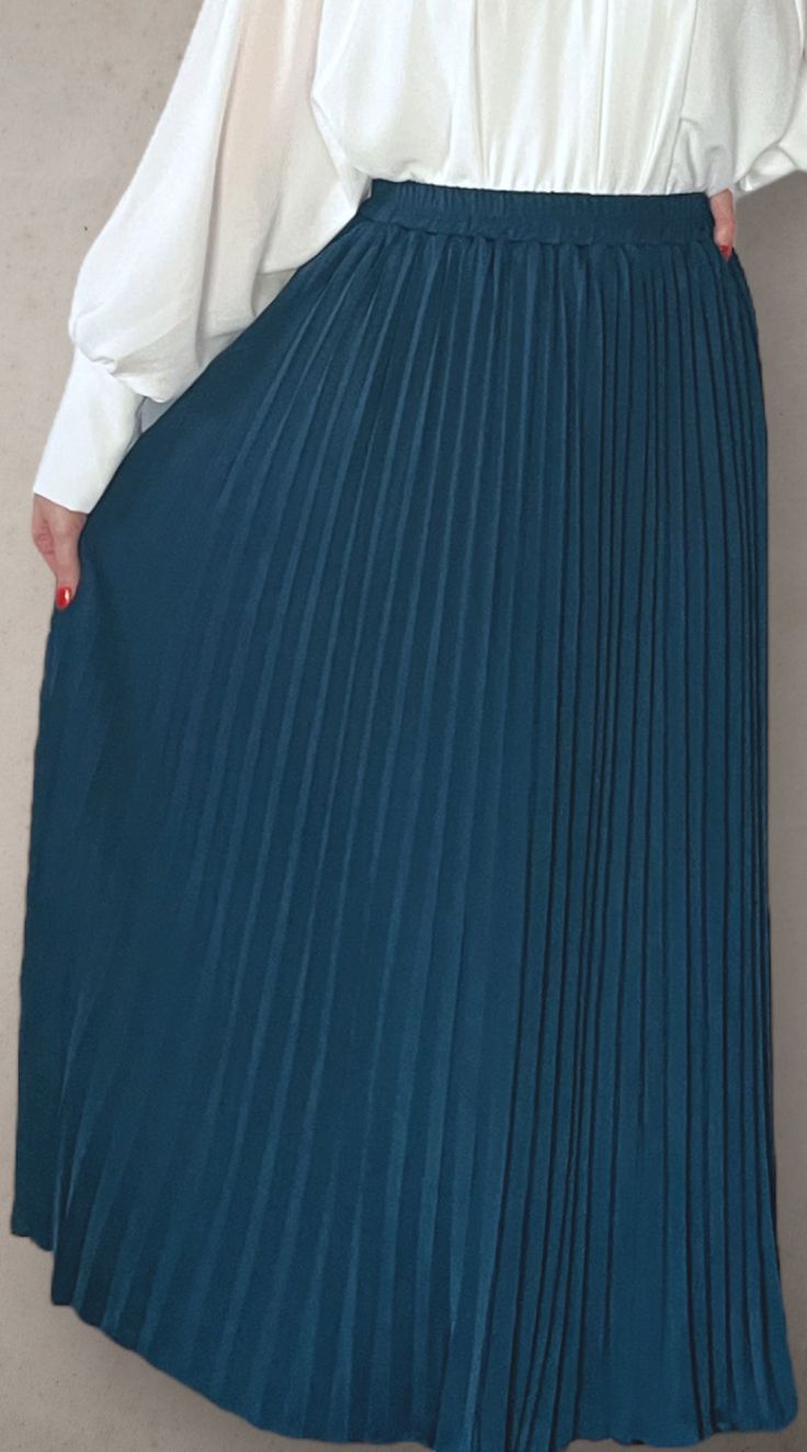 Modest high rise maxi skirt. Elastic waistband. Pleated. Fully lined for full coverage. Chic Full-length Solid Color Skirt, Spring Workwear Maxi Skirt Full Length, Chic Blue Accordion Pleated Skirt, Spring Workwear Maxi Skirt, Spring Workwear Full Length Maxi Skirt, Maxi Length Bottoms With Elastic Waistband For Fall, Elegant Full Length Solid Color Maxi Skirt, Fall Maxi Length Bottoms With Elastic Waistband, Spring Solid Color Full-length Maxi Skirt