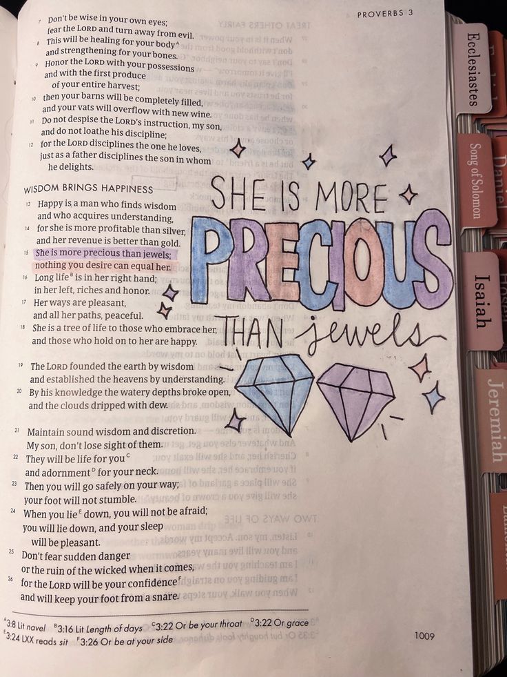 an open bible with the words she is more precious than jewels