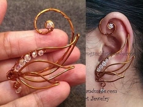 the ear is made out of gold wire and has crystal stones