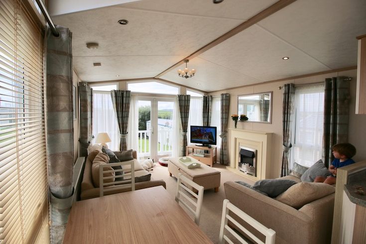 a living room filled with furniture and a fire place