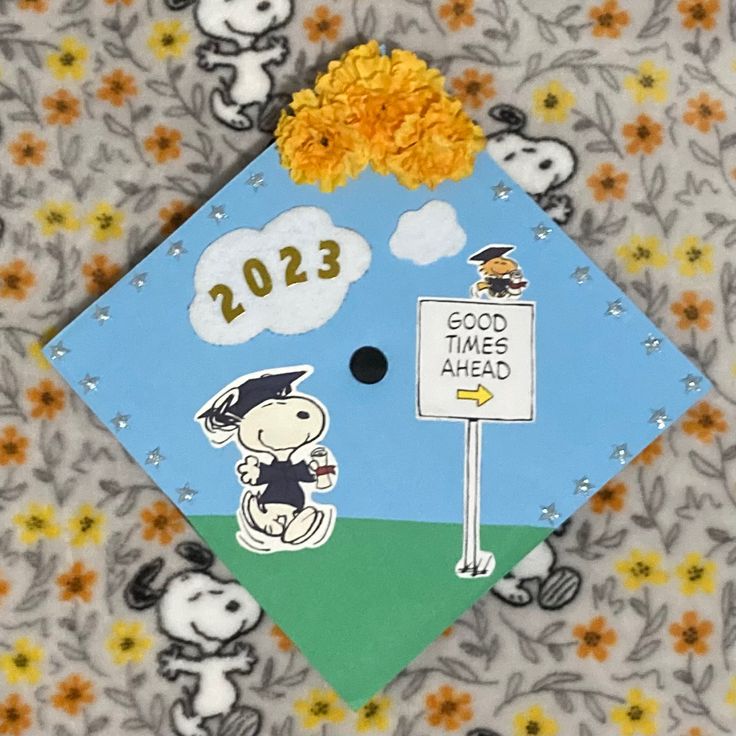 a graduation cap decorated with peanuts and flowers