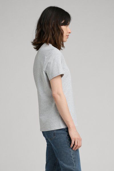 Cemented as the #1 womens’ essential by Jane Birkin in the 60's and 70's, The T-Shirt is the natural starting place for our growing permanent collection of women's essentials. Developed for longevity, both aesthetically and physically, our T-Shirt is made from a soft yet substantial mid-weight organic cotton jersey, designed to feel light without being frail or see-through. It's cut to a classic fit and accentuated with a slightly elevated, neatly ribbed neckline. Tuck it into a skirt, or make i Classic Gray Short Sleeve T-shirt, Classic Cotton T-shirt For Casual Gatherings, Gray Short Sleeve T-shirt For Everyday, Heather Grey Cotton Short Sleeve T-shirt, Basic Everyday Pre-shrunk Shirt, Heather Grey Tri-blend Cotton T-shirt, Heather Grey Cotton Tri-blend T-shirt, Gray Tri-blend Cotton T-shirt, Simple Organic Cotton Short Sleeve T-shirt