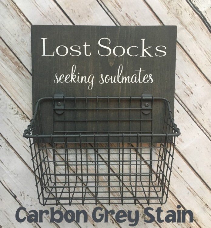 a sign that says lost socks seeking soulmates hanging from the side of a wall