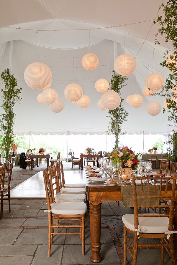 a large tent with tables and chairs set up for an event