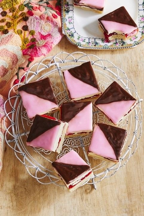 some pink and brown desserts are on a plate