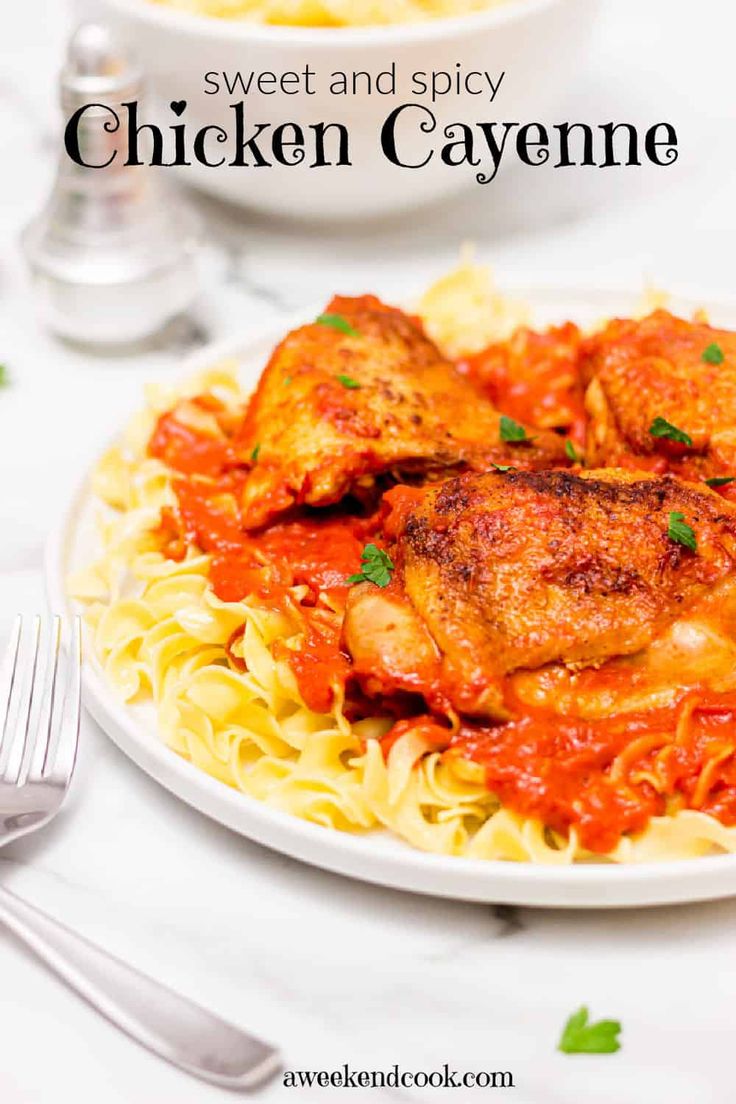 chicken cayenne served with pasta on a white plate