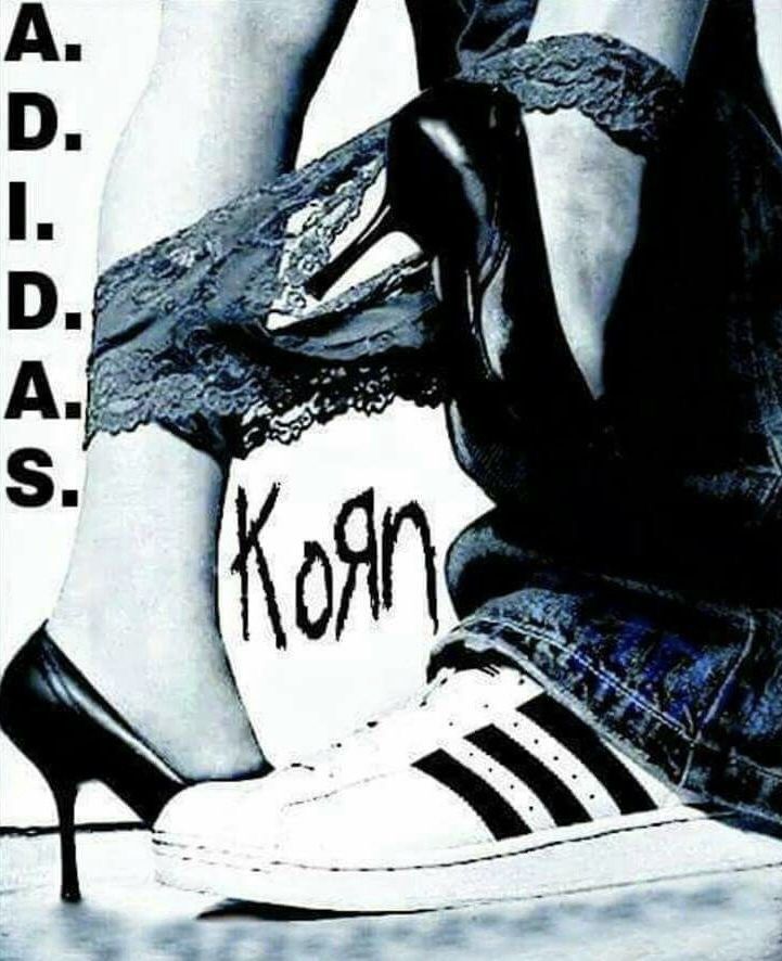 a woman's legs in high heels with the word korn written on them