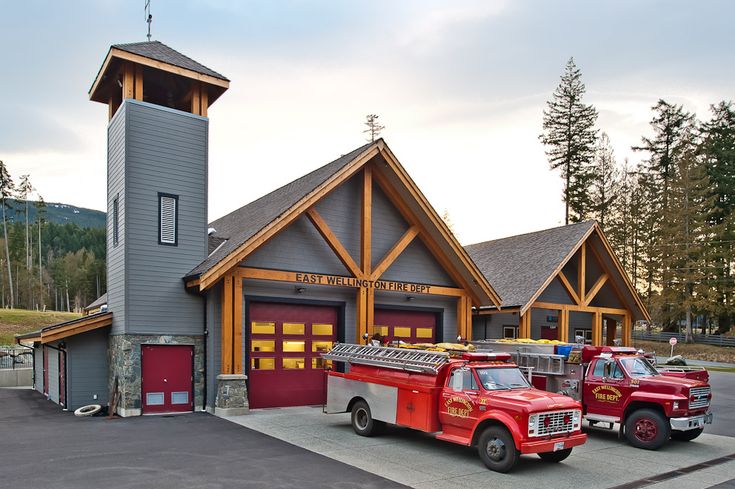 two fire trucks parked in front of a building