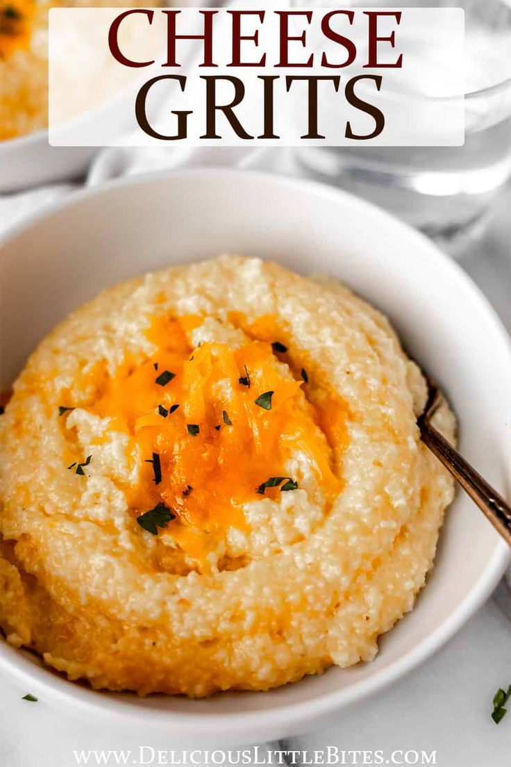 a white bowl filled with cheese grits on top of a table