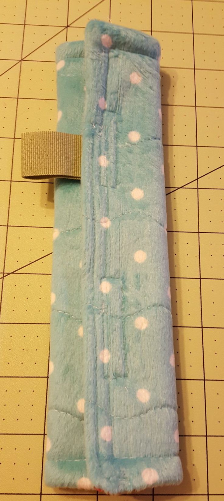 a blue towel with white polka dots on it