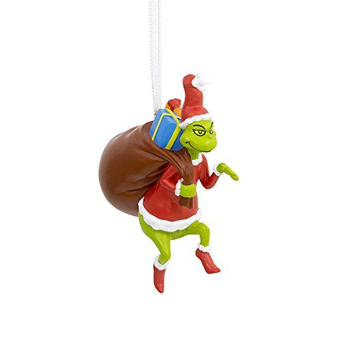 a christmas ornament hanging from a string with a bag on it's back